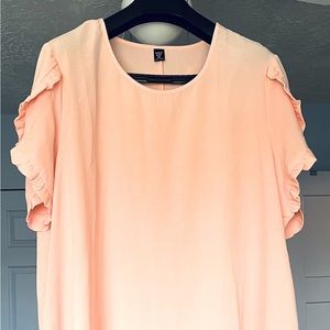 Short, shift dress with ruffle detail on the arms